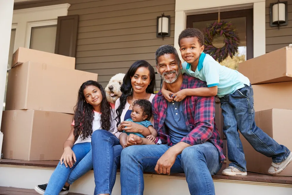 Happy family celebrating their successful move